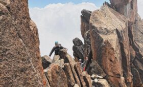 Climber scaling the North Face during a Mount Kenya technical climb